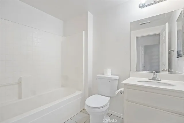 a bathroom with a toilet a sink and a bathtub