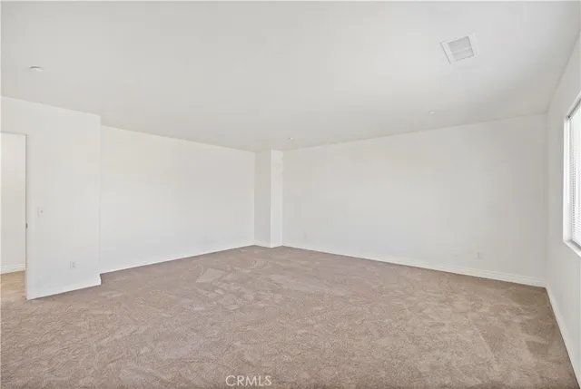 a spacious bathroom with a double vanity sink a mirror and a bathtub