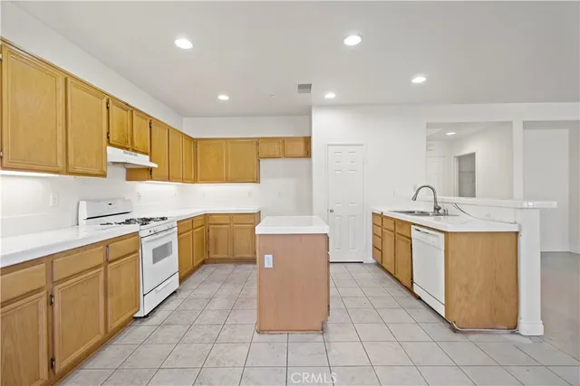 a kitchen with a sink counter top space and cabinets