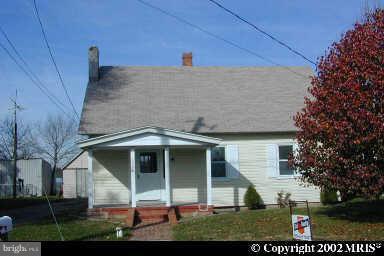 6258 Harmony Road Preston, MD 21655 - Photo 1 of 1 a front view of a house with a yard