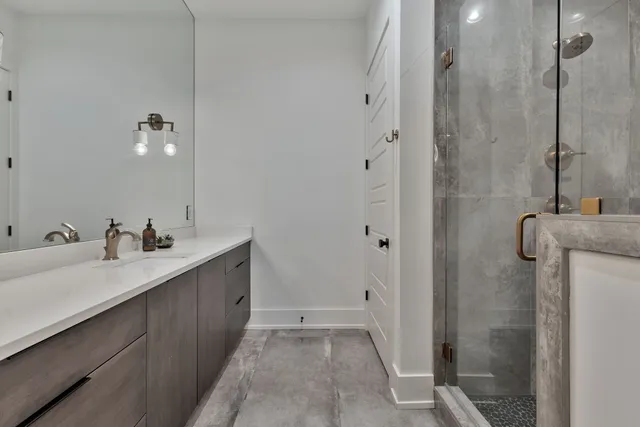 a bathroom with a double vanity sink a and mirror