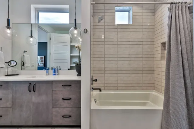 a bathroom with a bathtub and a sink