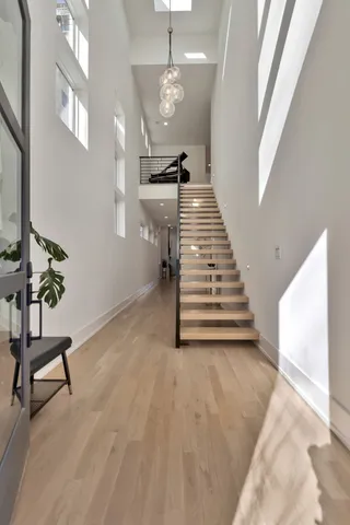 a view of a livingroom with furniture and stairs