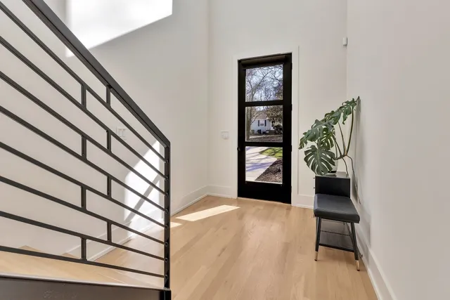 a view of a hallway and wooden floor