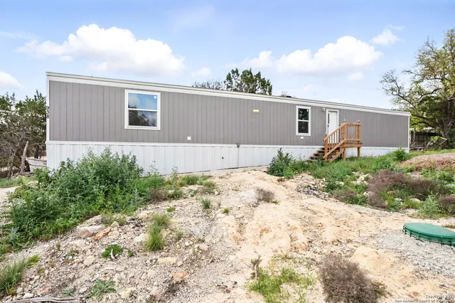 a house view with a backyard space