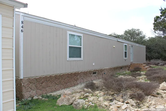 a bathroom with a shower and a toilet