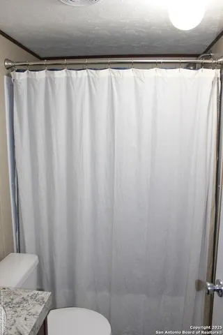 a kitchen with a refrigerator a sink and a stove