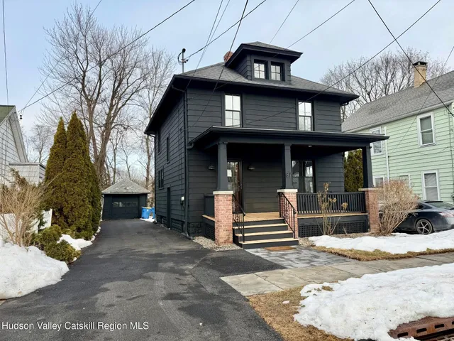 a view of a house with entrance gate