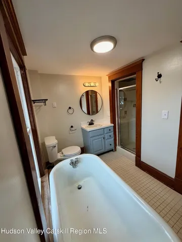 a en suite bathroom with a sink and mirror