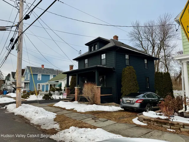 a view of a street with cars