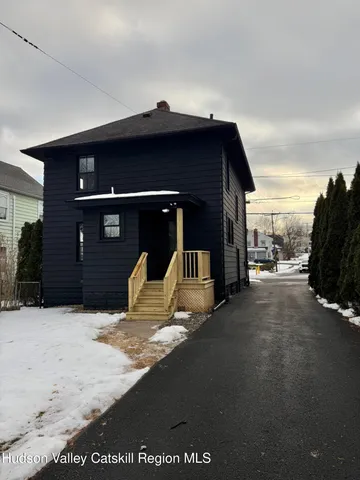 a bed room with a bed and a night stand