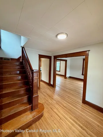 a view of an entryway with wooden floor