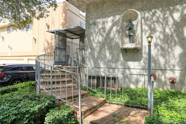 a view of a brick building with many windows