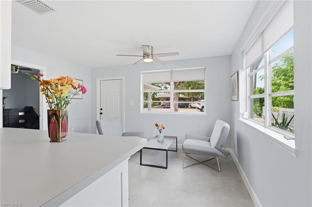 4518 West Alhambra Circle Naples, FL 34103 - Photo 14 of 40 a living room with furniture and window