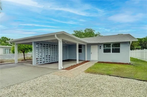 front view of a house with a yard