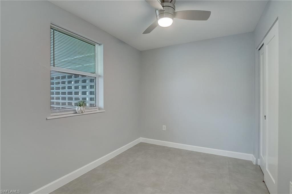 4518 West Alhambra Circle Naples, FL 34103 - Photo 32 of 40 an empty room with a window