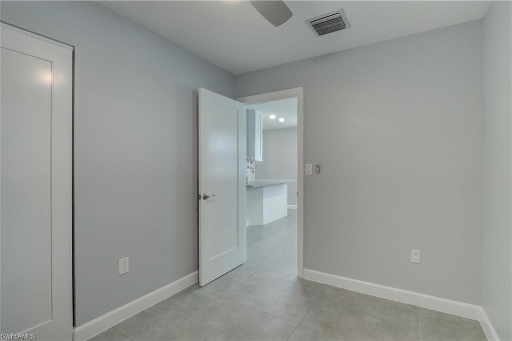 4518 West Alhambra Circle Naples, FL 34103 - Photo 33 of 40 an empty room with closet and a bathroom
