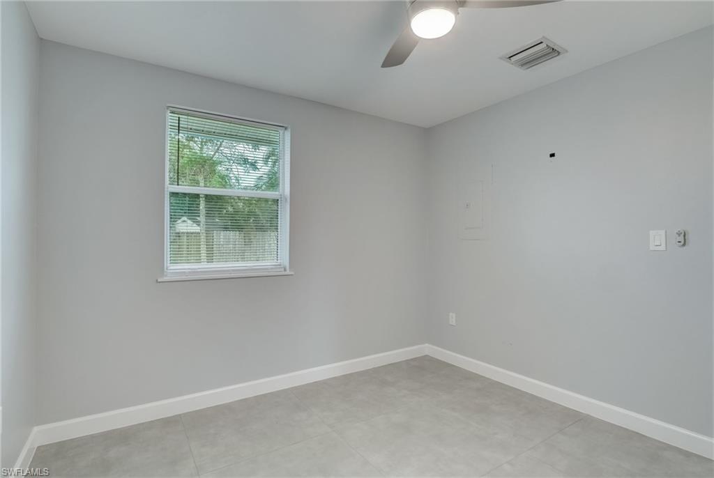 4518 West Alhambra Circle Naples, FL 34103 - Photo 34 of 40 an empty room with a window