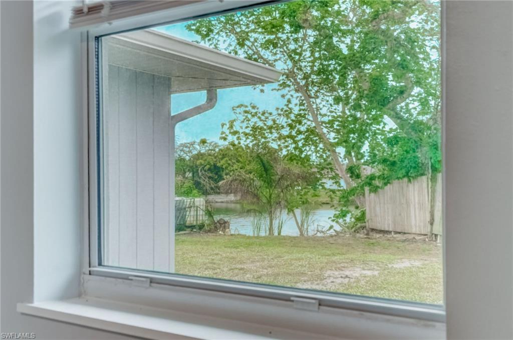 4518 West Alhambra Circle Naples, FL 34103 - Photo 36 of 40 a view of a house with a yard