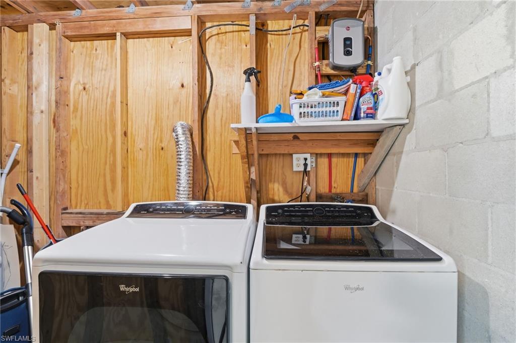 4518 West Alhambra Circle Naples, FL 34103 - Photo 39 of 40 a utility room with dryer and washer