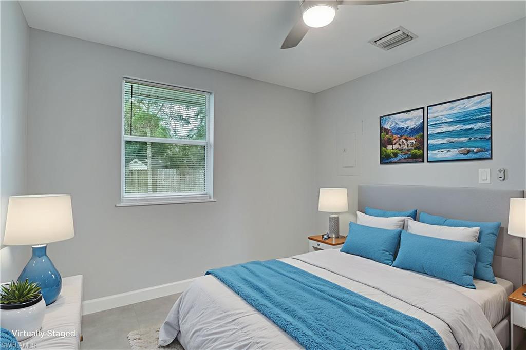 4518 West Alhambra Circle Naples, FL 34103 - Photo 10 of 40 a bedroom with bed and a window
