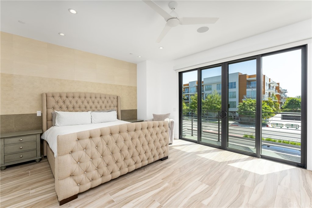 237 1st Street Huntington Beach, CA 92648 - Photo 18 of 68 a bedroom with a large bed and a large window