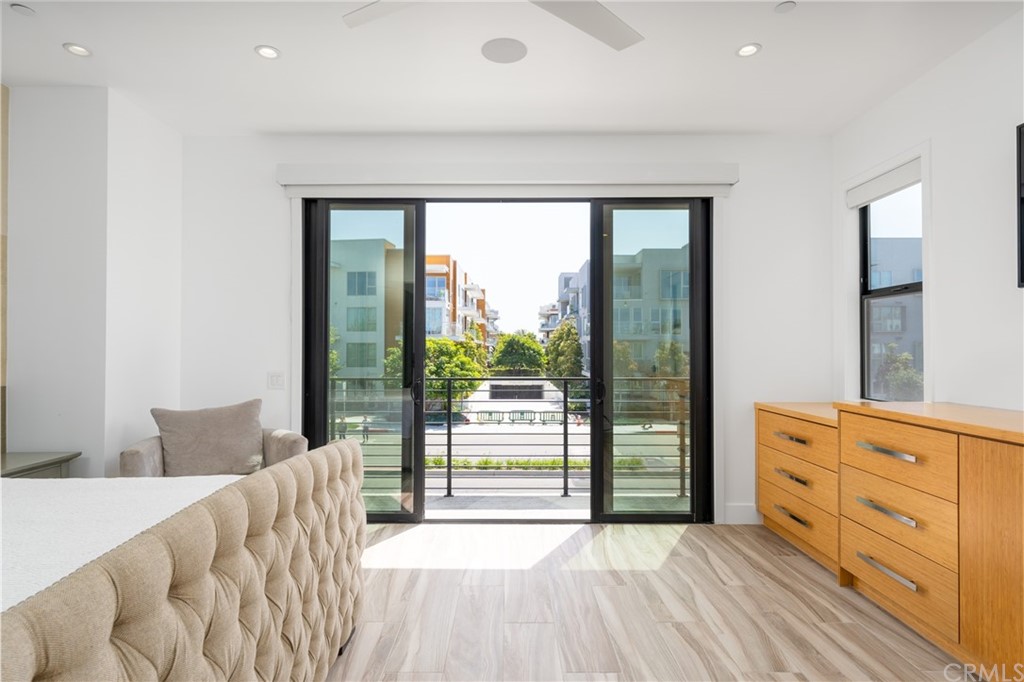 237 1st Street Huntington Beach, CA 92648 - Photo 19 of 68 a view of a bedroom with furniture and windows