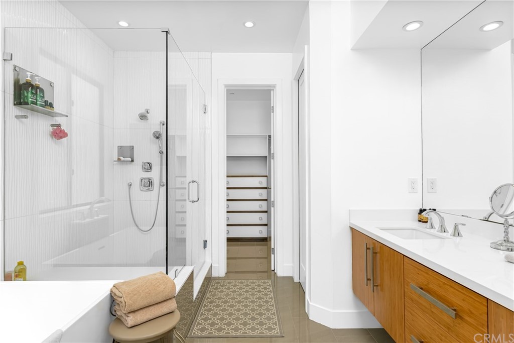 237 1st Street Huntington Beach, CA 92648 - Photo 23 of 68 a bathroom with a granite countertop sink a toilet and shower