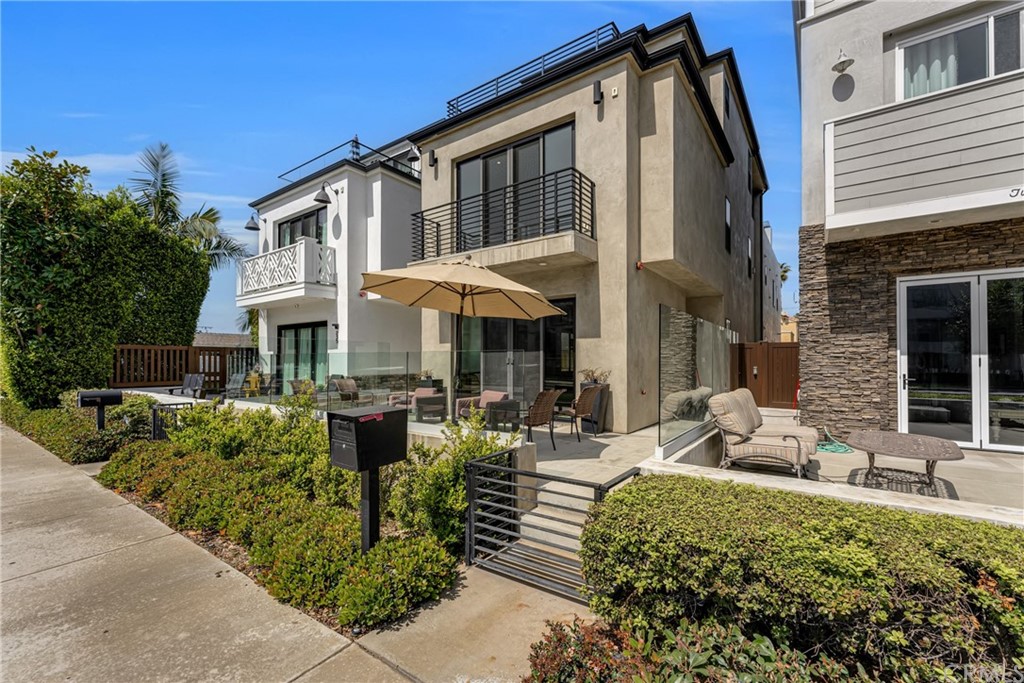 237 1st Street Huntington Beach, CA 92648 - Photo 3 of 68 a front view of a house with sitting area
