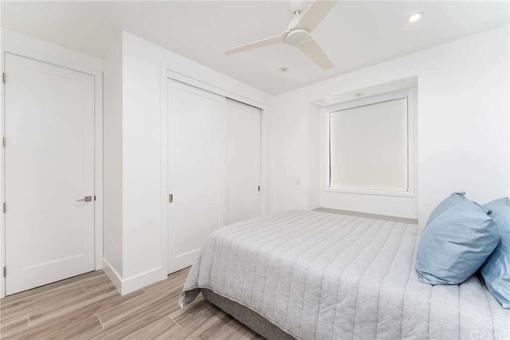 237 1st Street Huntington Beach, CA 92648 - Photo 32 of 68 a bedroom with a bed and a window