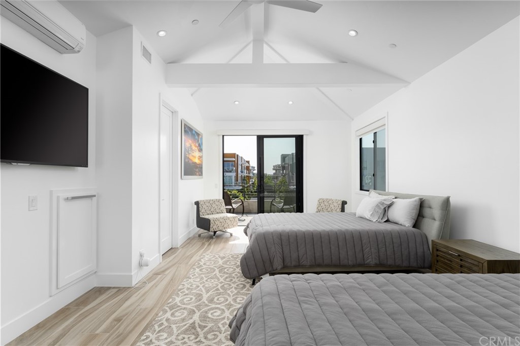 237 1st Street Huntington Beach, CA 92648 - Photo 35 of 68 a bedroom with a bed and a flat screen tv