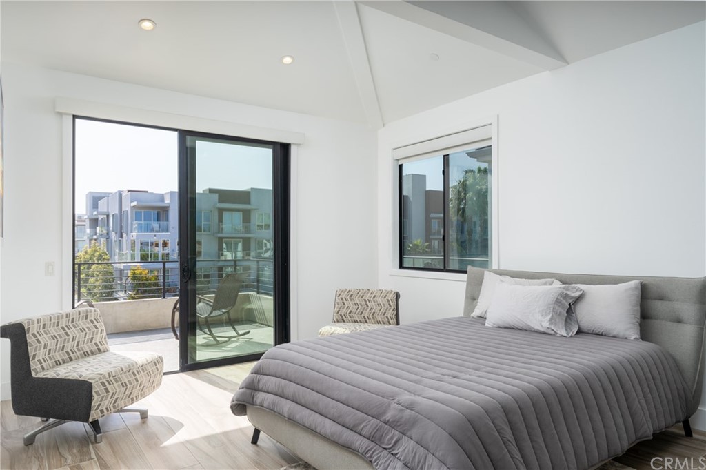 237 1st Street Huntington Beach, CA 92648 - Photo 36 of 68 a bedroom with a large bed and a large window