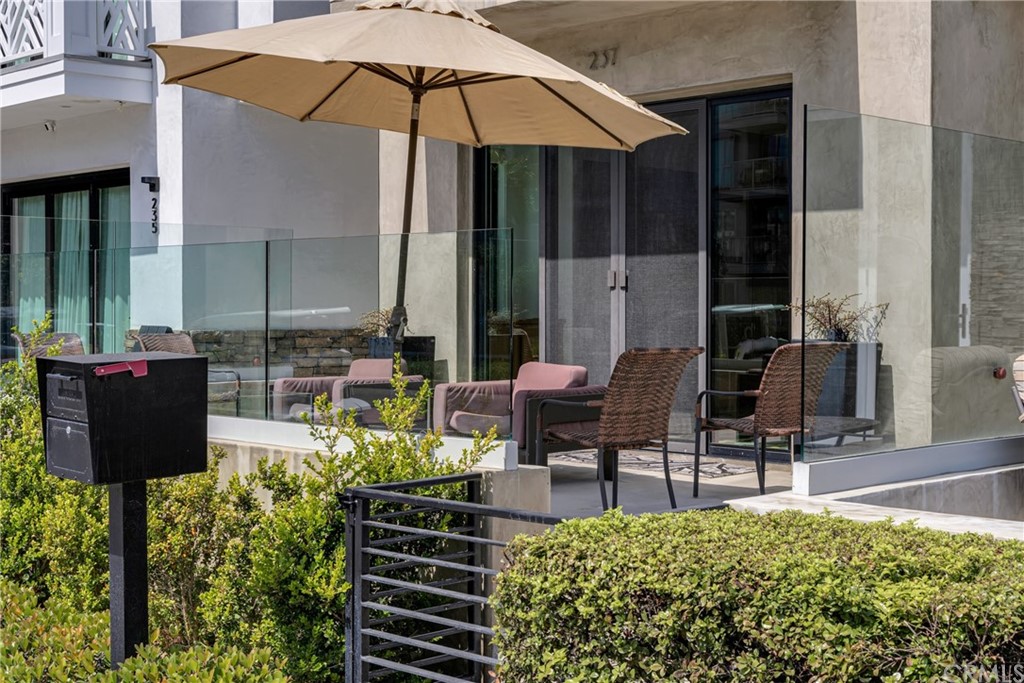 237 1st Street Huntington Beach, CA 92648 - Photo 4 of 68 a garden view with a seating space