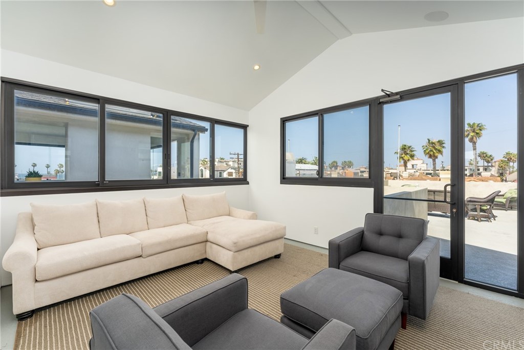 237 1st Street Huntington Beach, CA 92648 - Photo 42 of 68 a living room with furniture and a large window