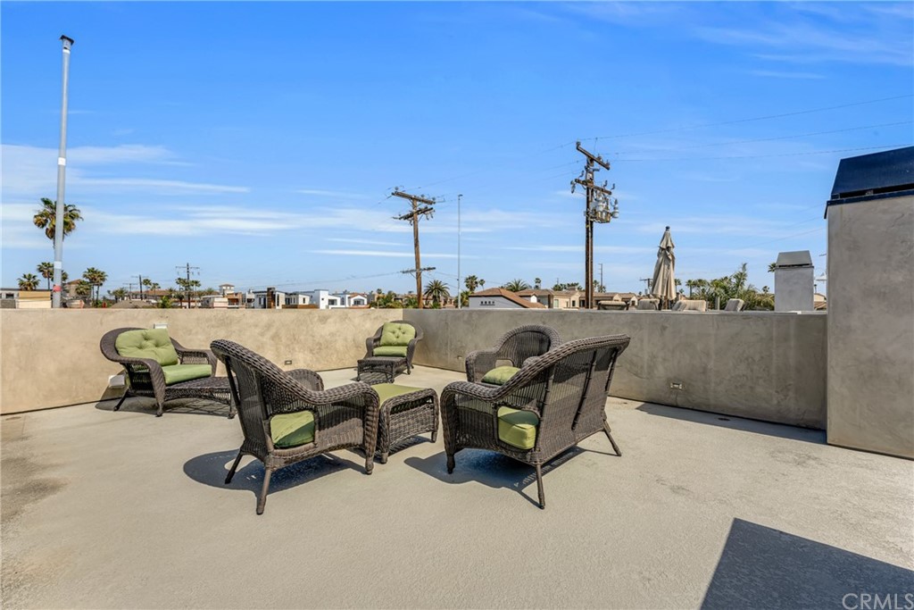 237 1st Street Huntington Beach, CA 92648 - Photo 46 of 68 a view of a terrace with chairs