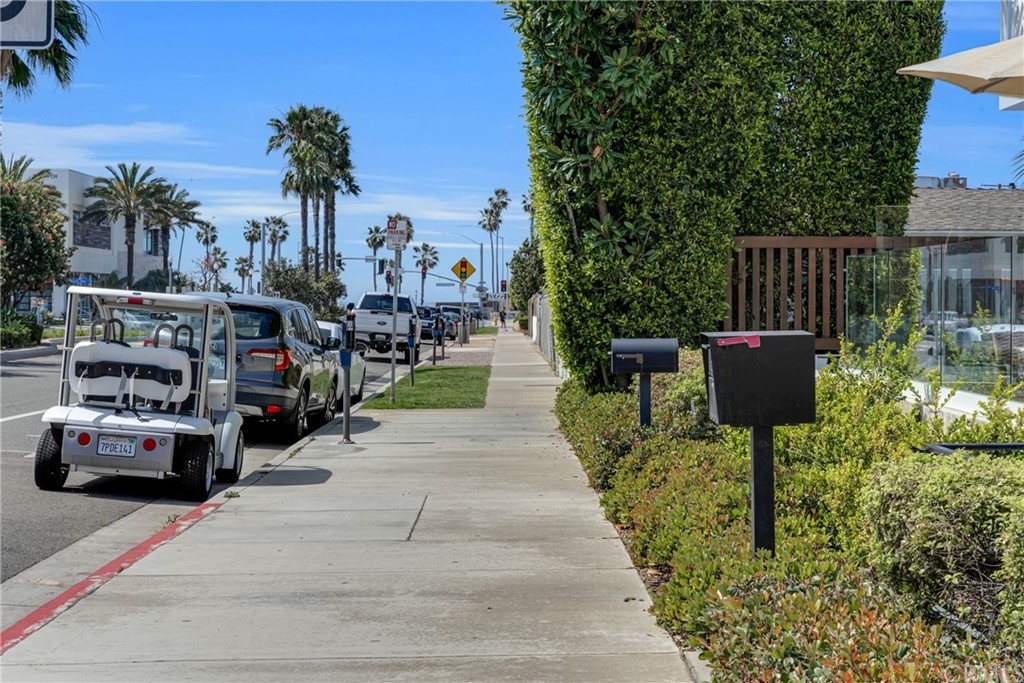 237 1st Street Huntington Beach, CA 92648 - Photo 55 of 68 a front view of a house with a garden