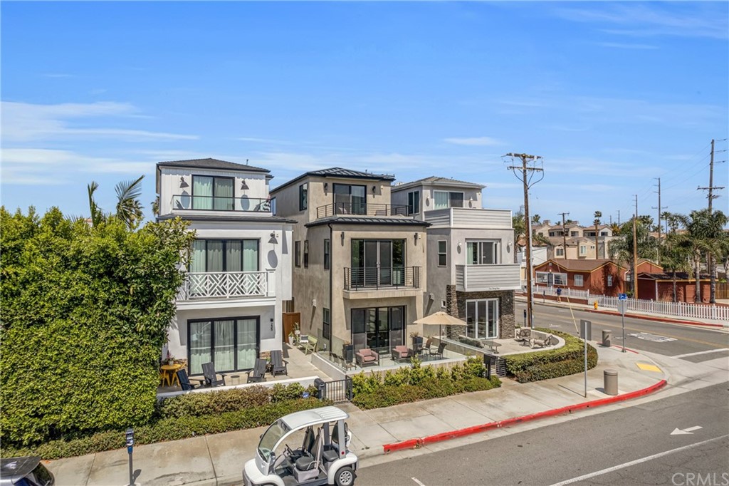 237 1st Street Huntington Beach, CA 92648 - Photo 57 of 68 a front view of a house with a garden and plants