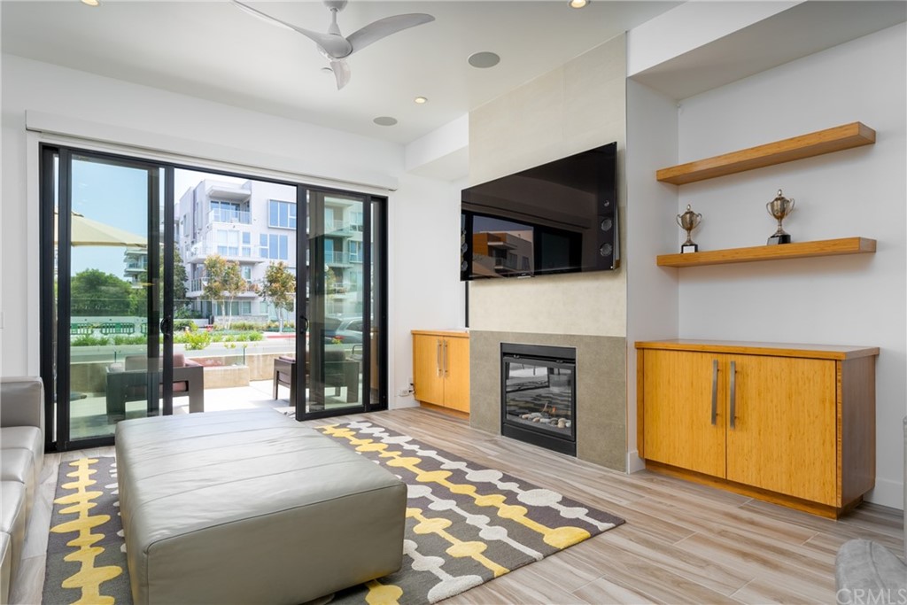 237 1st Street Huntington Beach, CA 92648 - Photo 8 of 68 a bedroom with a bed and a television