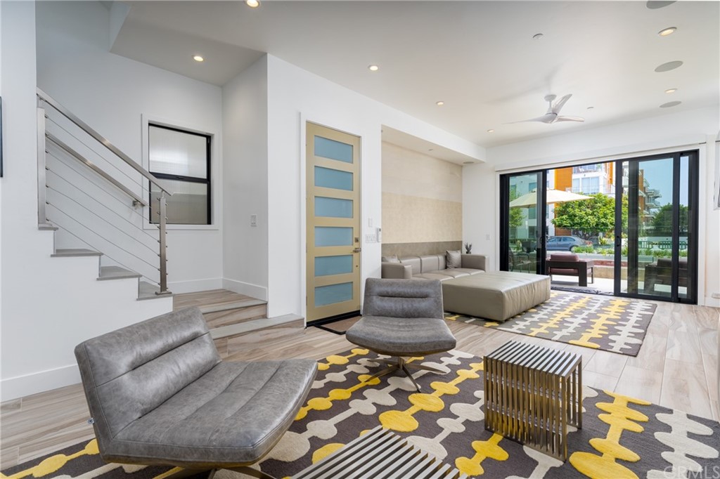 237 1st Street Huntington Beach, CA 92648 - Photo 9 of 68 a living room with furniture and a large window