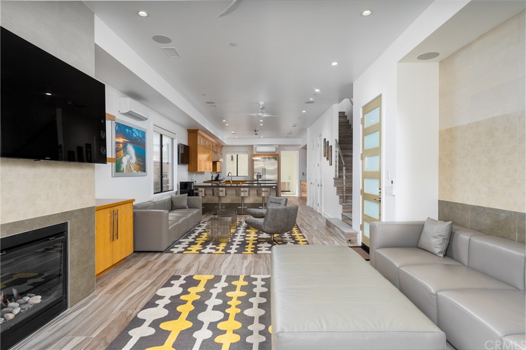 237 1st Street Huntington Beach, CA 92648 - Photo 10 of 68 a living room with furniture and a flat screen tv