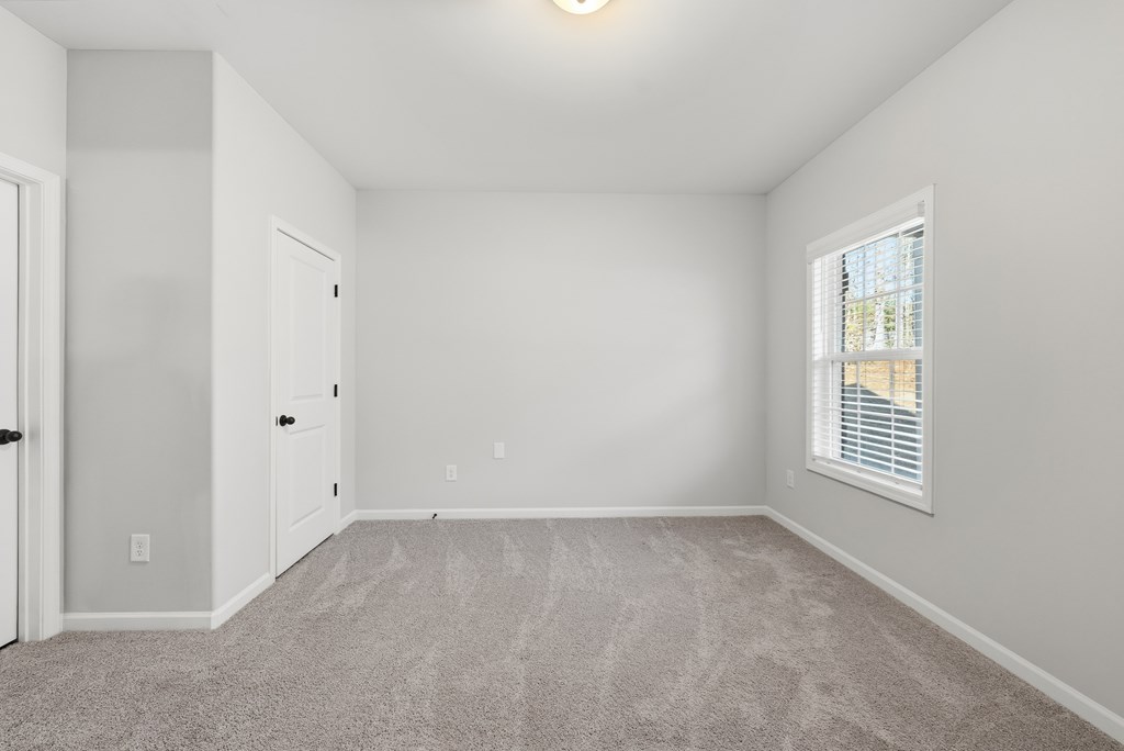 274 James Creek Road Fortson, GA 31808 - Photo 11 of 59 a view of an empty room with a window