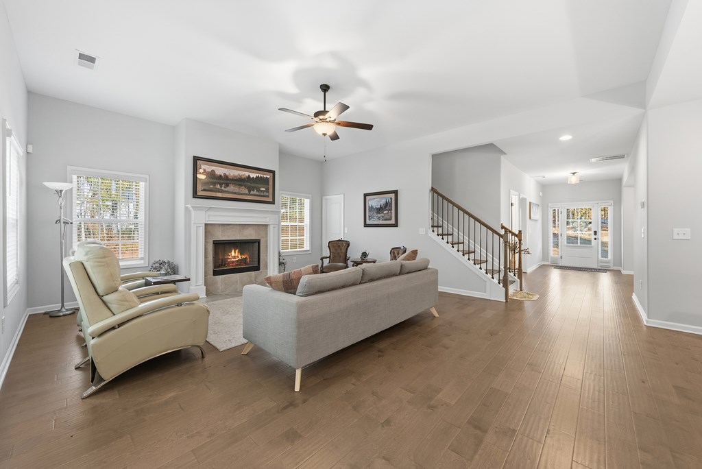 274 James Creek Road Fortson, GA 31808 - Photo 12 of 59 a living room with furniture and a fireplace