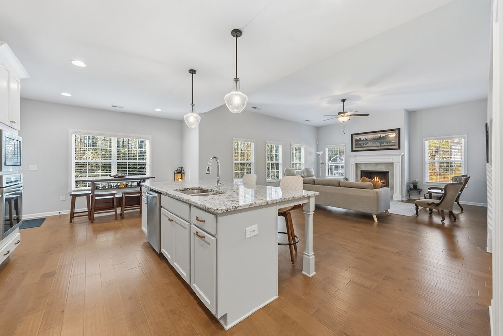 274 James Creek Road Fortson, GA 31808 - Photo 15 of 59 a kitchen with a stove and a wooden floors