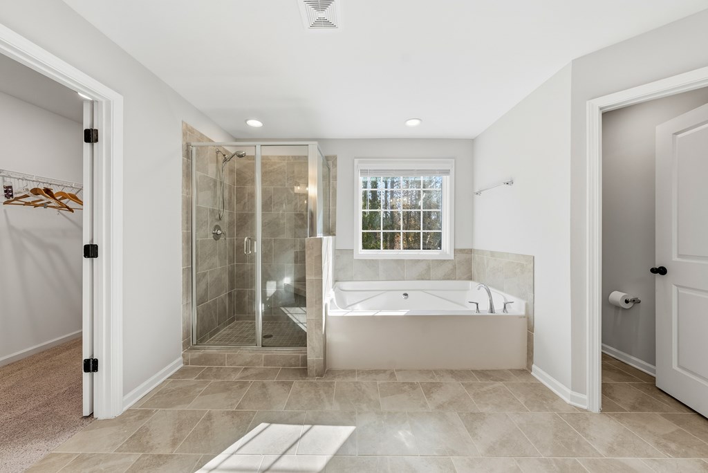 274 James Creek Road Fortson, GA 31808 - Photo 29 of 59 a spacious bathroom with a bathtub shower and a sink