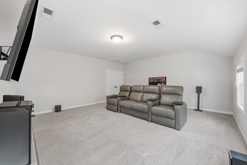 274 James Creek Road Fortson, GA 31808 - Photo 32 of 59 a living room with furniture and a flat screen tv