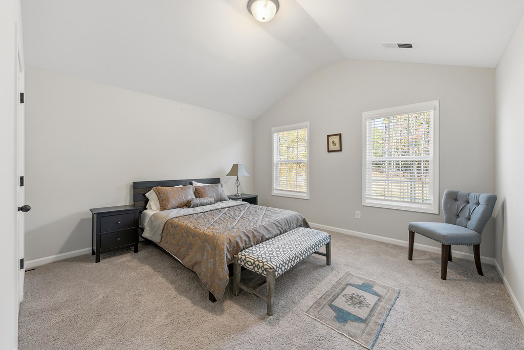 274 James Creek Road Fortson, GA 31808 - Photo 33 of 59 a spacious bedroom with a bed and a window
