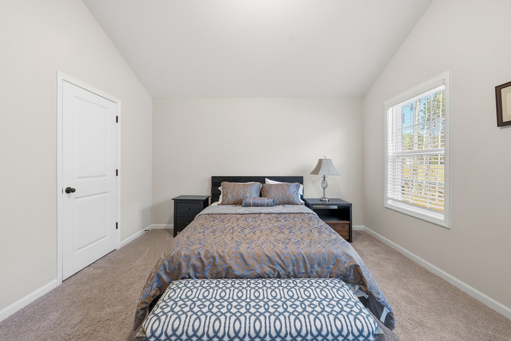 274 James Creek Road Fortson, GA 31808 - Photo 34 of 59 a bedroom with a bed and a window