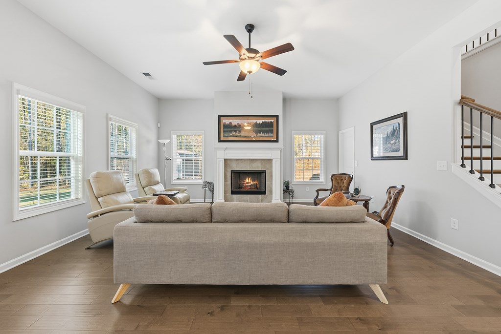 274 James Creek Road Fortson, GA 31808 - Photo 4 of 59 a living room with furniture a fireplace and a window