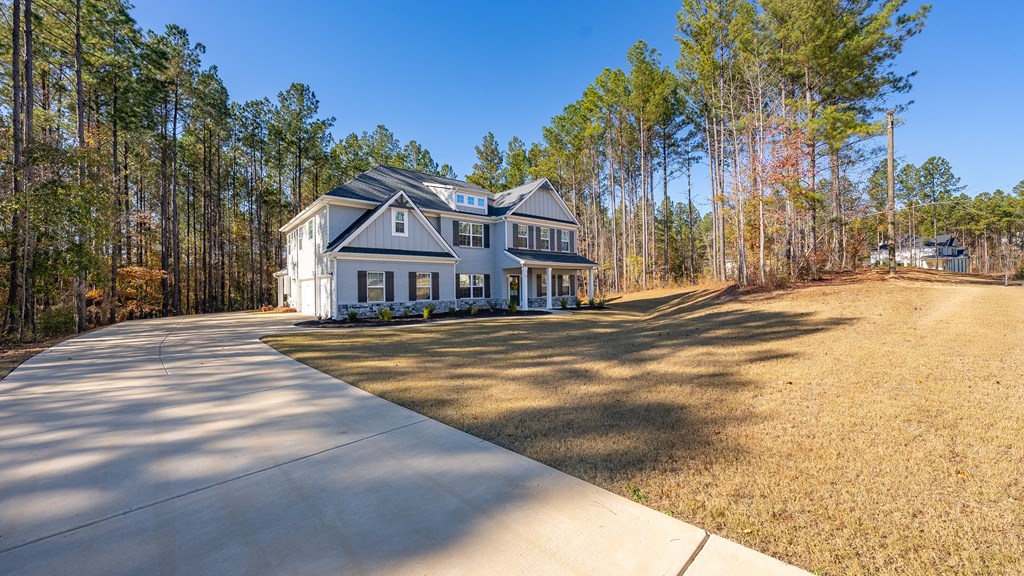 274 James Creek Road Fortson, GA 31808 - Photo 47 of 59 a front view of residential houses with yard and trees