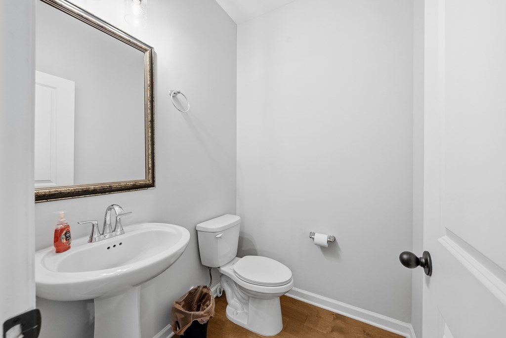 274 James Creek Road Fortson, GA 31808 - Photo 9 of 59 a bathroom with a sink toilet and a mirror